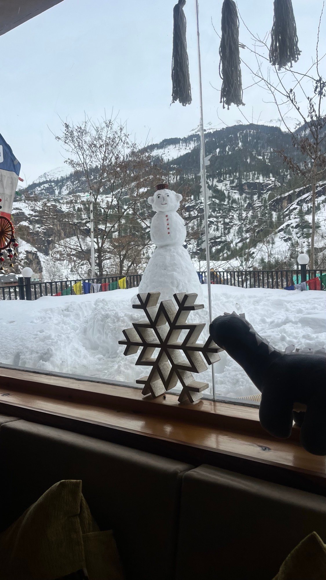 A snowman outside the window